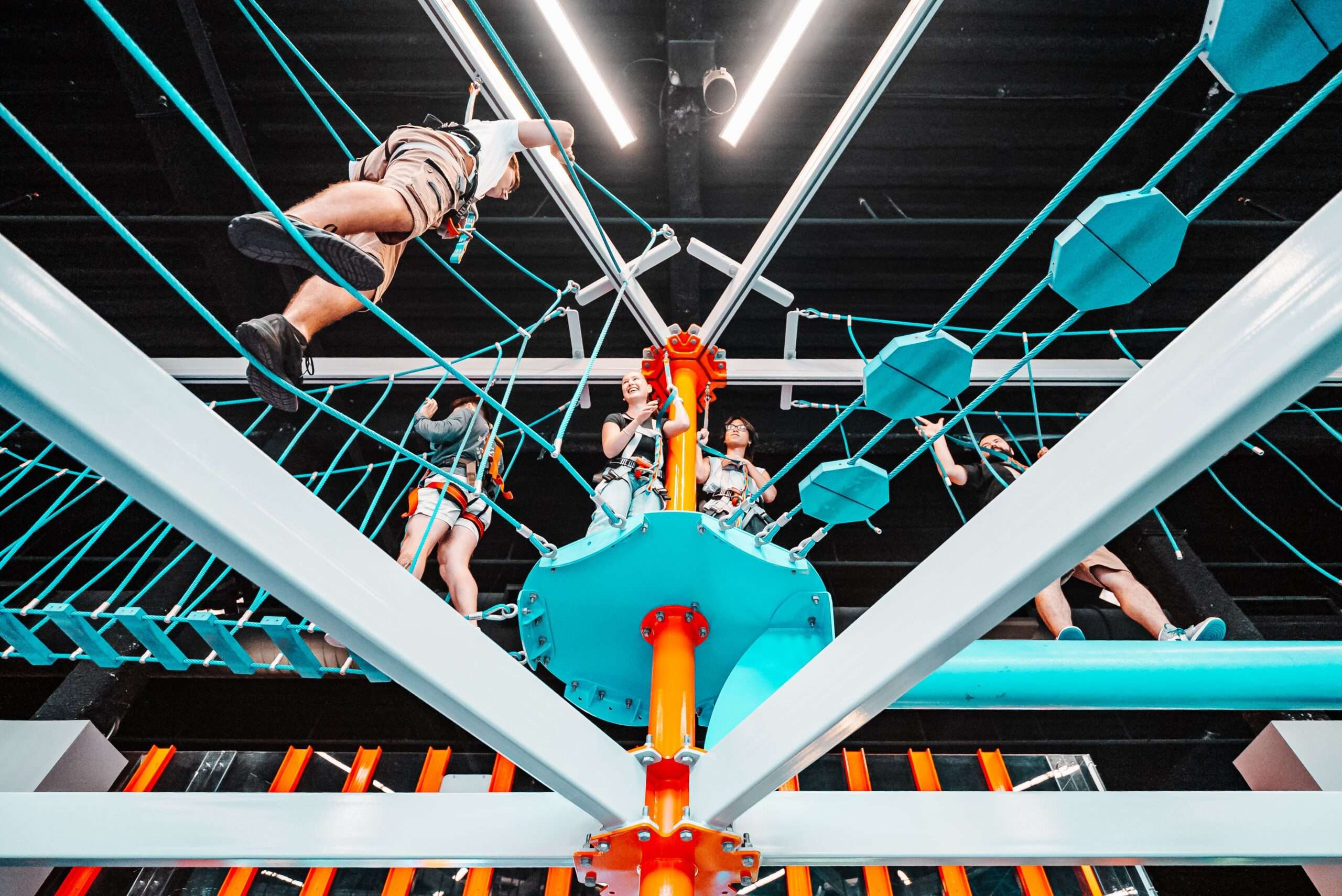 Climbers suspended high in the ropes course at Apex Entertainment